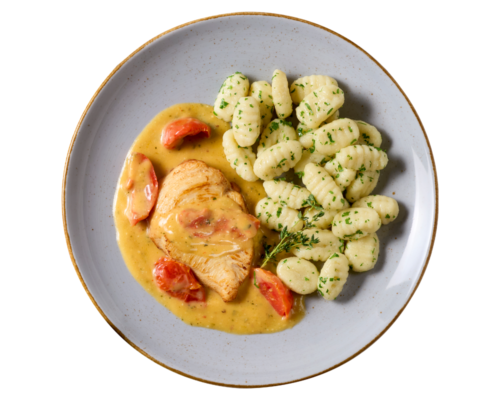 Sahne-Tomaten-Hähnchen von Hofmanns Shop mit Gnocchi und Kirschtomaten.