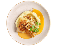 Zwei Kohlrouladen von Hofmanns Shop auf Kartoffelpüree mit Orangensauce und Petersilie.