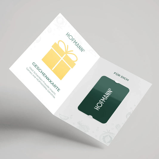 Offener Kartenhalter mit gelbem Geschenksymbol und grüner HOFMANNs Geschenkkarte aus dem Hofmanns Shop darin.