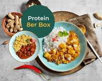 Zwei Schüsseln Curry mit Reis und Mais; HOFMANNs Protein-Box, die ideale Eiweiß-Mahlzeit.