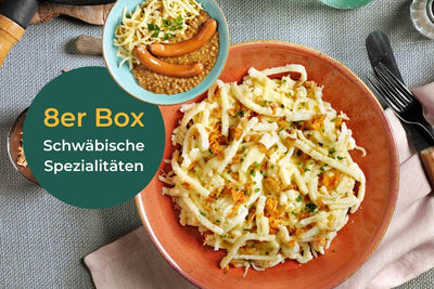 Genießen Sie Schwäbische Spezialitäten von HOFMANNs: Käsespätzle und Sieben-Schwaben-Topf mit Würstchen.